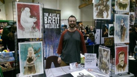 Brett Weldele manning his booth.